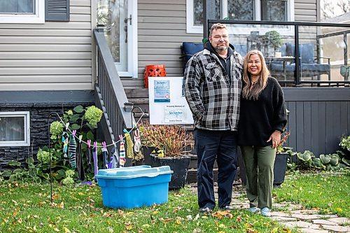 MIKAELA MACKENZIE / FREE PRESS
Jason Chester and Mylene Layno with their Socktober display in the front yard on Wednesday, Oct. 22, 2025. The husband-and-wife duo do a sock drive to collect socks for Main Street Project's Socktober campaign every year in honour of their late son, Justice Chester, who died in 2021 as a result of an intentional drug overdose.
For Aaron story.
Free Press 2025