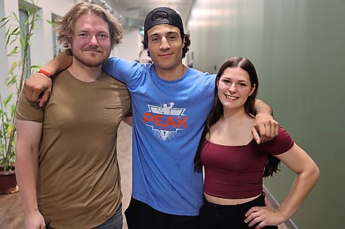 Brandon Fitness Combat Academy owner Ryker Batson (centre) with manager Logan Stouffer-Askham (left) and assistant manager Olivia Yurkiw-Keebie during the club's annual Fall Brawl Boxing event in the 70-kilogram category on Saturday evening. (Abiola Odutola/The Brandon Sun)