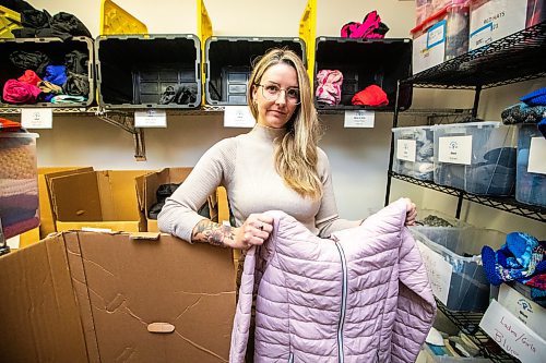 MIKAELA MACKENZIE / FREE PRESS

Hillary Gair, senior manager for engagement initiatives at United Way Winnipeg, at Koats for Kids on Monday, Oct. 27, 2025. Their stock of kids jackets is running low due to a lack of donations (especially in sizes 8-12, like the one she is holding).

For intern story.
Free Press 2025