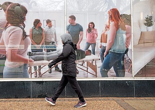 A pedestrian passes by The Learning Company on Rosser Avenue on a rainy Monday morning. The Learning Company is a registered private vocational institute that specializes in health care, business and advanced training programs and skill development workshops, according to its website. (Tim Smith/The Brandon Sun)