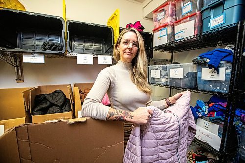 MIKAELA MACKENZIE / FREE PRESS

Hillary Gair, senior manager for engagement initiatives at United Way Winnipeg, at Koats for Kids on Monday, Oct. 27, 2025. Their stock of kids jackets is running low due to a lack of donations (especially in sizes 8-12, like the one she is holding).

For intern story.
Free Press 2025
