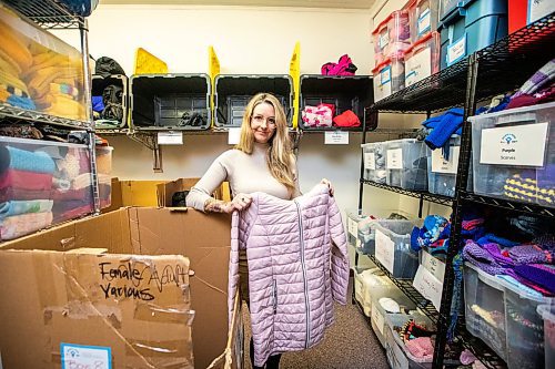 MIKAELA MACKENZIE / FREE PRESS

Hillary Gair, senior manager for engagement initiatives at United Way Winnipeg, at Koats for Kids on Monday, Oct. 27, 2025. Their stock of kids jackets is running low due to a lack of donations (especially in sizes 8-12, like the one she is holding).

For intern story.
Free Press 2025