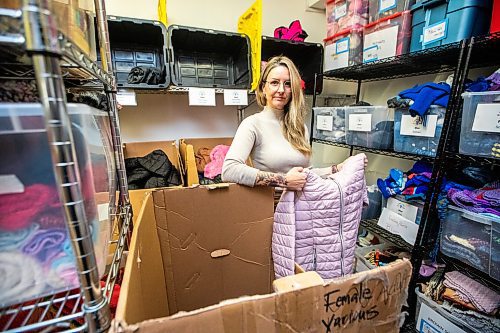 MIKAELA MACKENZIE / FREE PRESS

Hillary Gair, senior manager for engagement initiatives at United Way Winnipeg, at Koats for Kids on Monday, Oct. 27, 2025. Their stock of kids jackets is running low due to a lack of donations (especially in sizes 8-12, like the one she is holding).

For intern story.
Free Press 2025