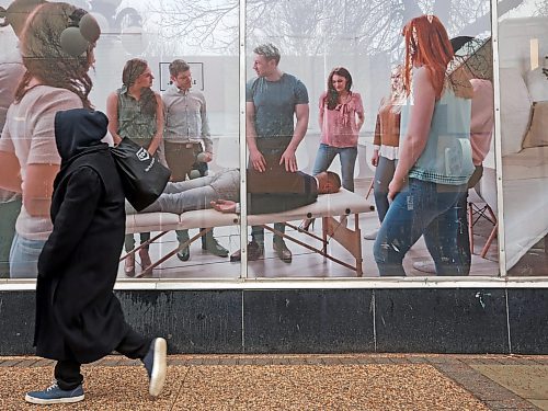 27102025
A pedestrian passes by The Learning Company on Rosser Avenue on a rainy Monday morning. 
(Tim Smith/The Brandon Sun)