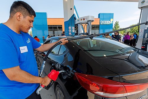 MIKE DEAL / FREE PRESS
Roman McDougall at the pump for a customer shortly after the Grand Opening ceremonies of Oodena Gas &amp; Convenience &#x2014;Treaty One&#x2019;s first retail venture and the inaugural business launch at Naawi-Oodena, Friday morning.
Standup 
250725 - Friday, July 25, 2025.