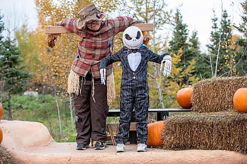 BROOK JONES/FREE PRESS
The Assiniboine Park Conservancy hosts Boo at the Zoo as the Assiniboine Park Zoo has been transformed into the mysterious and magical town of Spookyville. Pictured: Connor Kostynuik, 6, (right) who is dressed as movie character Jack Skellington from The Nightmare Before Christmas while he interacts with Sam Starek, 18, who is dressed as a scarecrow in Patch & Jack Lane during Boo at The Zoo in Winnipeg, Man., Wednesday, Oct. 29, 2025.