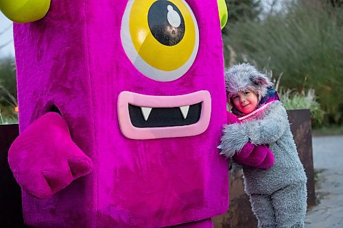 BROOK JONES/FREE PRESS
The Assiniboine Park Conservancy hosts Boo at the Zoo as the Assiniboine Park Zoo has been transformed into the mysterious and magical town of Spookyville during Boo at The Zoo in Winnipeg, Man., Wednesday, Oct. 29, 2025. Pictured: Maddie Bowden, 4, (right) who is dressed as a wolf, gives Icky, who is a a friendly, candy-loving troll mascot for the Assiniboine Park Zoo's Boo at the Zoo event and introduced in 2011, a hug. Playing the character of Icky was international student Kokone Nakada, 17.