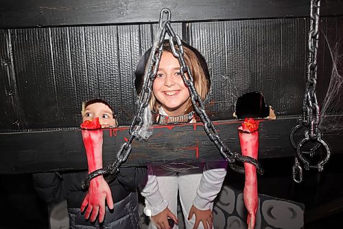 30102025
Cousins Reece Slack and Adelyn Commer explore the haunted house at Alternative Choice Garden Centre in Brandon on Thursday. Alternative Choice Garden Centre, The Green Spot and Livingstone Outdoor have all teamed up for the Halloween Hop, offering Halloween-related activities to visitors and collecting donations for various local charities.
(Tim Smith/The Brandon Sun)