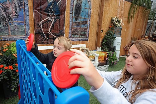 30102025
Cousins Reece Slack and Adelyn Commer play connect four at the Haunted Greenhouse: Boo For A Cause! at Alternative Choice Garden Centre in Brandon on Thursday. Alternative Choice Garden Centre, The Green Spot and Livingstone Outdoor have all teamed up for the Halloween Hop, offering Halloween-related activities to visitors and collecting donations for various local charities.
(Tim Smith/The Brandon Sun)