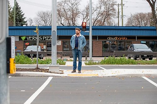 BROOK JONES/FREE PRESS
School trustee for Louis Riel School Division, Ward 3, Ryan Palmquist is advocating along with other school trustees for a sweeping re-design of the 30 km/h speed limit in school zones. Palmquist is pictured standing on the media of St. Anne's Road where the intersection of St. Anne's Road and Varennes Avenue in Winnipeg, Man., has been upgraded to a pedestrian crossing signal. Palmquist is pictured on Thursday, Oct. 30, 2025.