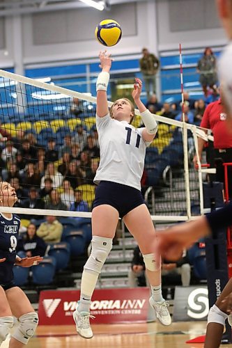 Brandon's Carly Thomson dumps the ball against the Mount Royal Cougars during their Canada West women's volleyball match at the Healthy Living Centre on Friday. (Thomas Friesen/The Brandon Sun)