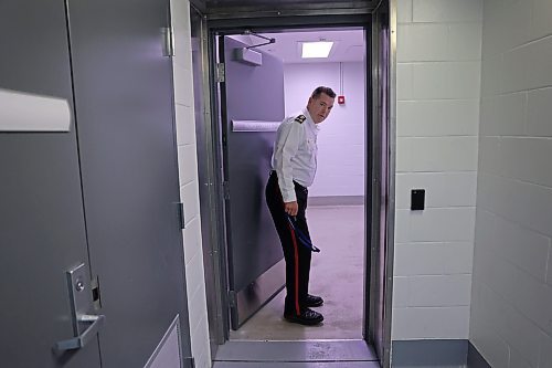 Brandon Police Chief Tyler Bates opens a door into the recently constructed police detention faciliy at BPS headquarters on Victoria Avenue and 10th Street during a brief tour of the facility with the Brandon Sun. (Matt Goerzen/The Brandon Sun)