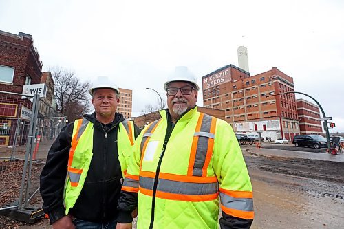 The City of Brandon's general manager of operations, Todd Burton, right, stands with Dave Dyck, acting manager of underground utilities, during an interview with the Sun along Rosser Avenue on Friday afternoon. (Matt Goerzen/The Brandon Sun)