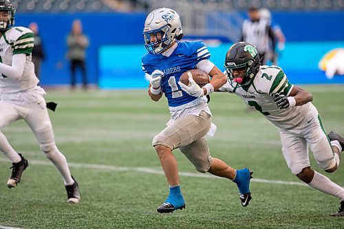 BROOK JONES/FREE PRESS
The Oak Park Raiders host the Vincent Massey Trojans in Winnipeg High School Football League AAAA Tier 1 semifinal action at Princess Auto Stadium in Winnipeg, Man., Friday, Oct. 31, 2025. The Raiders eared a 46-7 victory. Pictured: Oak Park Raiders wide receiver Adam Kilmister (No. 1) runs with the football while Vincent Massey Trojans defensive back Mitchell Effiok-Osu (No. 2) tries to tackle him during second quarter action.