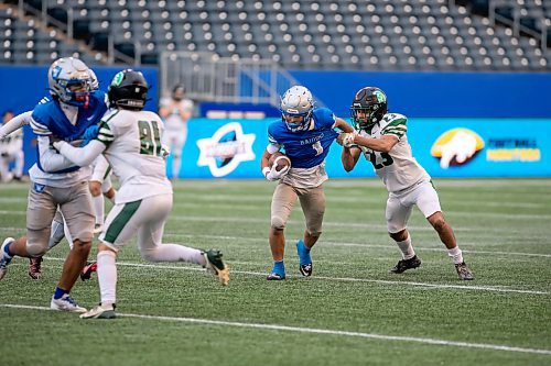 BROOK JONES/FREE PRESS
The Oak Park Raiders host the Vincent Massey Trojans in Winnipeg High School Football League AAAA Tier 1 semifinal action at Princess Auto Stadium in Winnipeg, Man., Friday, Oct. 31, 2025. The Raiders eared a 46-7 victory. Pictured: Oak Park Raiders wide receiver Adam Kilmister (No. 1) runs with the football while Vincent Massey Trojans McCarlo Shaw (No. 23) tries to tackle him during second quarter action.