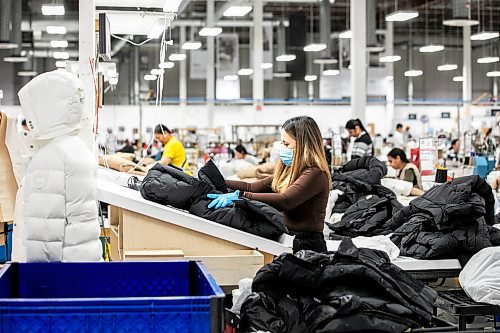 MIKAELA MACKENZIE / FREE PRESS
Keithleen Valdez inspects finished coats at the Canada Goose factory in Winnipeg on Tuesday, Nov. 4, 2025.
For Aaron Epp story.
Free Press 2025