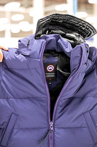 MIKAELA MACKENZIE / FREE PRESS
Andres Quiroz, director of manufacturing, holds a coat at the Canada Goose factory in Winnipeg on Tuesday, Nov. 4, 2025.
For Aaron Epp story.
Free Press 2025