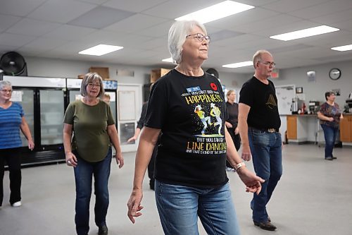 10112025
Barb Berry sports an upbeat line dancing shirt while taking part in the weekly beginner line dancing class with other dance enthusiasts at the Seniors for Seniors Co-Op on Monday morning.
(Tim Smith/The Brandon Sun)