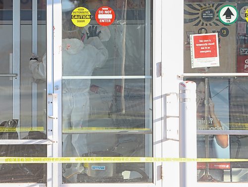 Mike Deal / Free Press
The Shoppers at 795 Keewatin Street is closed after an incident. Cleaners can be seen in hazmat suits wiping down the entrance area and disposing of cloths in garbage bags. A security guard posted outside the store had nothing to say. Police tape draped across the outside of the store. 
251112 - Wednesday, November 12, 2025. 