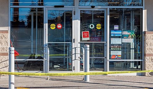 MIKE DEAL / FREE PRESS
The Shoppers at 795 Keewatin Street is closed after an incident. Cleaners can be seen in hazmat suits wiping down the entrance area and disposing of cloths in garbage bags. A security guard posted outside the store had nothing to say. Police tape draped across the outside of the store.
251112 - Wednesday, November 12, 2025.