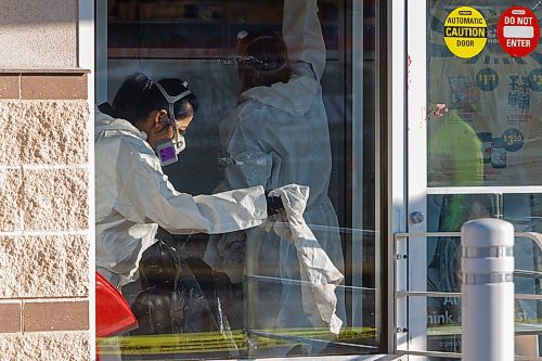 MIKE DEAL / FREE PRESS
The Shoppers at 795 Keewatin Street is closed after an incident. Cleaners can be seen in hazmat suits wiping down the entrance area and disposing of cloths in garbage bags. A security guard posted outside the store had nothing to say. Police tape draped across the outside of the store.
251112 - Wednesday, November 12, 2025.