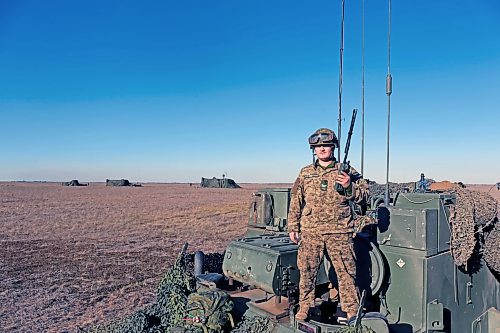 Michael St. Louis McIntosh pops out of the command post during a pause between artillery firing missions at CFB Shilo. McIntosh is one of a team that calculated how to fire shells roughly 8 kilometres down range. (Connor McDowell/The Brandon Sun)