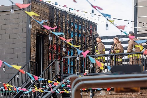 MIKE DEAL / FREE PRESS
According to CJOB police said WFPS trucks were called to La Roca, 155 Smith Street, around 6 a.m., where they found smashed windows and damage to the outside patio.
Police and fire crews were still on the scene as well as a construction crew cutting boards for the windows.
251114 - Friday, November 14, 2025.