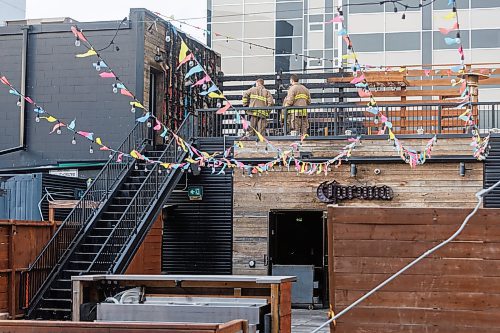 MIKE DEAL / FREE PRESS
According to CJOB police said WFPS trucks were called to La Roca, 155 Smith Street, around 6 a.m., where they found smashed windows and damage to the outside patio.
Police and fire crews were still on the scene as well as a construction crew cutting boards for the windows.
251114 - Friday, November 14, 2025.