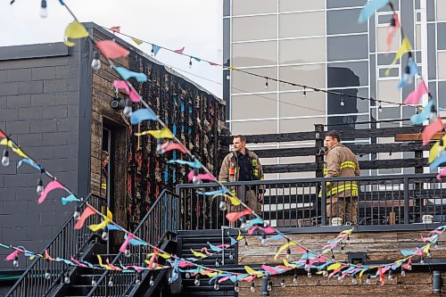 MIKE DEAL / FREE PRESS
According to CJOB police said WFPS trucks were called to La Roca, 155 Smith Street, around 6 a.m., where they found smashed windows and damage to the outside patio.
Police and fire crews were still on the scene as well as a construction crew cutting boards for the windows.
251114 - Friday, November 14, 2025.