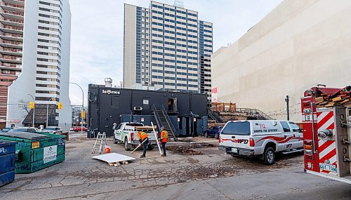 MIKE DEAL / FREE PRESS
According to CJOB police said WFPS trucks were called to La Roca, 155 Smith Street, around 6 a.m., where they found smashed windows and damage to the outside patio.
Police and fire crews were still on the scene as well as a construction crew cutting boards for the windows.
251114 - Friday, November 14, 2025.
