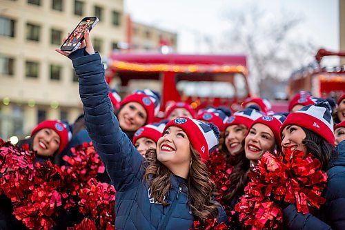 BROOK JONES/FREE PRESS
Members of the Montreal Cheer Team have a selfie taken before the start of the Manitoba Hydro Santa Claus Parade Grey Cup Edition in Winnipeg, Man., Saturday, Nov. 15, 2025. The band members were part of the Edmonton Elks Cheer Team parade entry. The Santa Claus parade has run annually in Winnipeg since the former Eaton’s department store organized the first one in 1909.