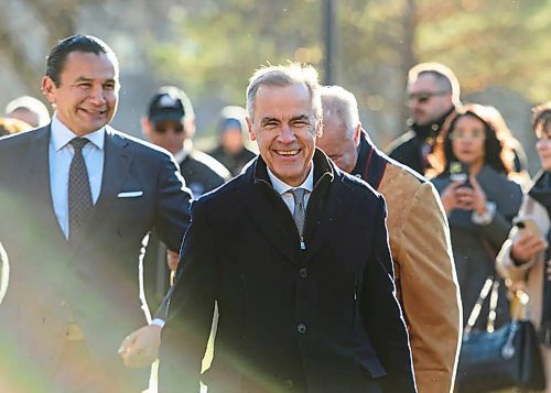 Prime Minister Mark Carney walks along side Manitoba Premier Wab Kinew and MMF president David Chartrand during an unrelated event Sunday morning prior to the Port of Churchill announcement. (Mike Sudoma/Winnipeg Free Press files)