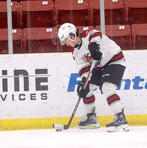 Bryce Bryant picks up a pass along the boards during an Oil Capitals man advantage against the Blizzard. (Massimo De Luca-Taronno/The Brandon Sun)