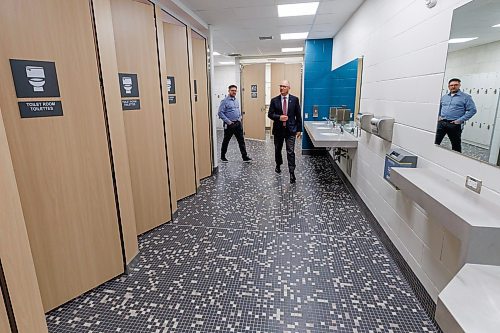 MIKE DEAL / FREE PRESS
In the Universal Changeroom, Mayor Scott Gillingham is given a tour of the renovated facility by Chris Brown, Admin Coordinator with Recreation Service Division.
Mayor Scott Gillingham, councillor Vivian Santos (Point Douglas), Chairperson of the Standing Policy Committee on Community Services, and councillor Matt Allard (St. Boniface) celebrate the reopening of Bonivital Pool (1215 Archibald St.) after it underwent major renovations, which included accessibility upgrades in the front lobby, including new universal and gendered changerooms, a new accessible sauna, upgrades to the heating, ventilation, and air conditioning (HVAC), water heating system, and air handling unit.
Reporter: Joyanne Pursaga
251119 - Wednesday, November 19, 2025.