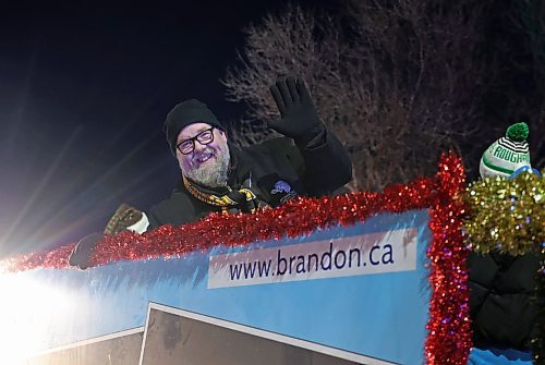 Brandon Coun. Shaun Cameron (Ward ??) waves during evening preparations before the start of the Santa Claus Parade in Brandon on Saturday evening. (Abiola Odutola/The Brandon Sun)