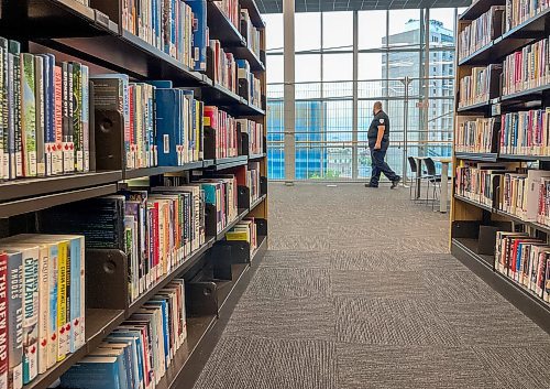 MIKE DEAL / FREE PRESS
A security guard patrols along the new fencing that has been put up on the Millennium library’s fourth floor as it reopens Tuesday following a suicide earlier this month.
Reporter: Nicole Buffie
250902 - Tuesday, September 02, 2025.