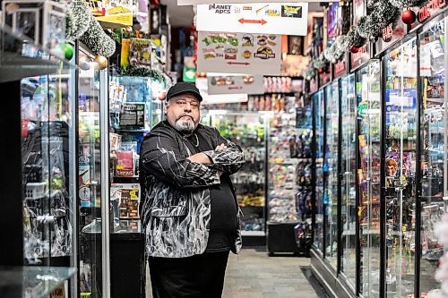 MIKAELA MACKENZIE / FREE PRESS

Michael Paille, owner of Cobra Collectibles and executive director at Sargent Business Community, in his store on Friday, Nov. 28, 2025. He&#x2019;s had to lock up most of his merchandise in glass cases to fight crime.

For Malak story.
Free Press 2025