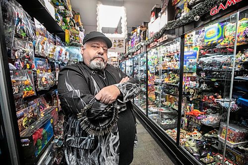 MIKAELA MACKENZIE / FREE PRESS

Michael Paille, owner of Cobra Collectibles and executive director at Sargent Business Community, in his store on Friday, Nov. 28, 2025. He&#x2019;s had to lock up most of his merchandise in glass cases to fight crime.

For Malak story.
Free Press 2025