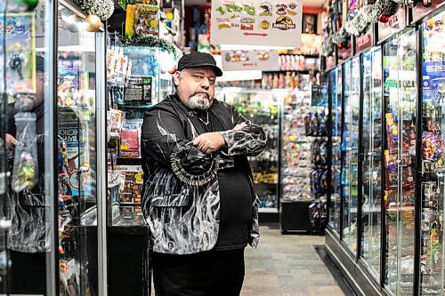MIKAELA MACKENZIE / FREE PRESS

Michael Paille, owner of Cobra Collectibles and executive director at Sargent Business Community, in his store on Friday, Nov. 28, 2025. He&#x2019;s had to lock up most of his merchandise in glass cases to fight crime.

For Malak story.
Free Press 2025