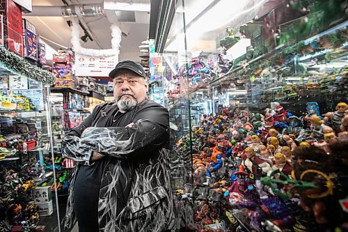 MIKAELA MACKENZIE / FREE PRESS

Michael Paille, owner of Cobra Collectibles and executive director at Sargent Business Community, in his store on Friday, Nov. 28, 2025. He&#x2019;s had to lock up most of his merchandise in glass cases to fight crime.

For Malak story.
Free Press 2025