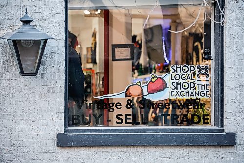 JOHN WOODS / WINNIPEG FREE PRESS
The Exchange District Biz annual “Shop Local, Shop The Exchange” campaign this month on store windows Monday, December 1, 2025. Rodney Francisco, co-owner of the Collab Shop, is participating in the program.

reporter: aaron