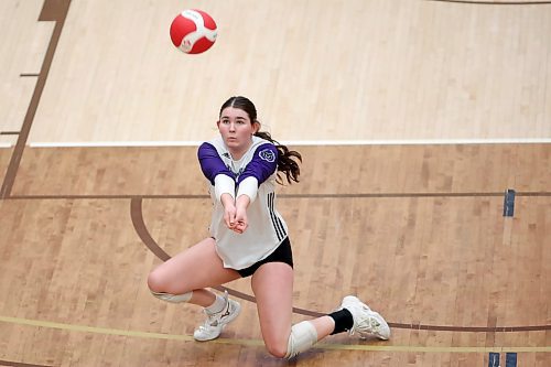 01122025
Reece Cowan #7 of the Vincent Massey Vikings digs the ball during the AAAA varsity girls volleyball provincial final against the Jeanne-Sauvé Olympiens at the University of Manitoba in Winnipeg on Monday evening. 
(Tim Smith/The Brandon Sun)