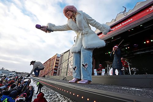 Country musicians Jade Eagleson and Teigen Gayse visit with fans while performing during the CPKC Holiday Train stop in Neepawa on Friday. The train also made stops in Portage la Prairie, Minnedosa and Shoal Lake on Friday. See story on page A4. (Tim Smith/The Brandon Sun)