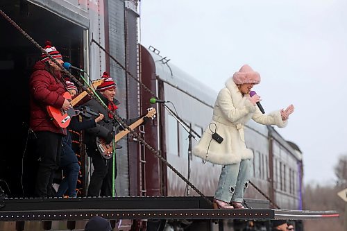 05122025
Country musician Teigen Gayse performs during the CPKC Holiday Train stop in Neepawa on Friday. The train also made stops in Portage la Prairie, Minnedosa and Shoal Lake on Friday. The annual  CPKC Holiday Train raises money and food to support local food banks throughout its journey. 
(Tim Smith/The Brandon Sun)