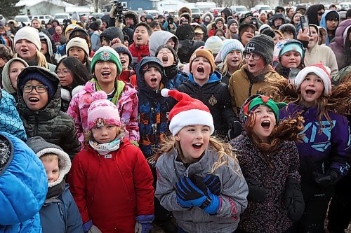 05122025
Kids cheer and sing along as country musician Teigen Gayse performs during the CPKC Holiday Train stop in Neepawa on Friday. The train also made stops in Portage la Prairie, Minnedosa and Shoal Lake on Friday. The annual  CPKC Holiday Train raises money and food to support local food banks throughout its journey. 
(Tim Smith/The Brandon Sun)
