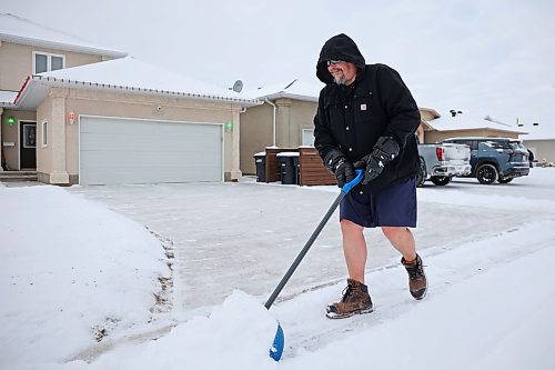 08122025
Andrew Walker shovels fresh snow from his driveway in Brandon on Monday afternoon. According to Environment Canada, Brandon is under a winter storm watch for Tuesday. 
(Tim Smith/The Brandon Sun)