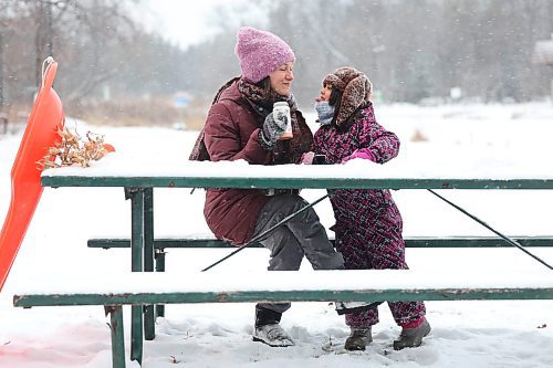 Ruth Bonneville / Free Press 

Local  Weather Standup - Snowy Hot Choc

\ Five-and-a half-year-old Anisia and her mom Marina goof around as they share some hot chocolate with snow in it (to cool it off) at a picnic table after sliding down the toboggan run on a snowy afternoon at the Assiniboine Park Tuesday.  

Anisia is home schooled so they two of them love to come to the park after she gets her school work finished for the day.   

Dec 9th,  2025
