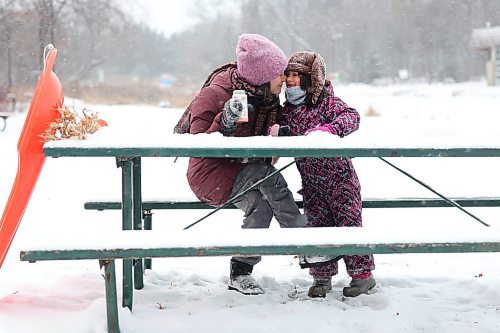 Ruth Bonneville / Free Press 

Local  Weather Standup - Snowy Hot Choc

\ Five-and-a half-year-old Anisia and her mom Marina goof around as they share some hot chocolate with snow in it (to cool it off) at a picnic table after sliding down the toboggan run on a snowy afternoon at the Assiniboine Park Tuesday.  

Anisia is home schooled so they two of them love to come to the park after she gets her school work finished for the day.   

Dec 9th,  2025
