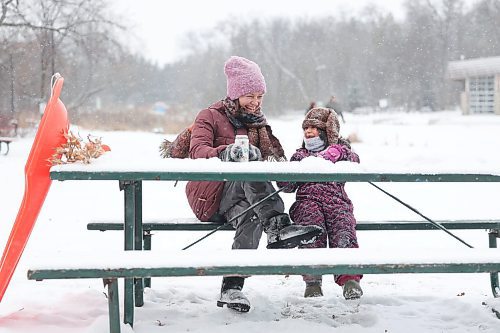 Ruth Bonneville / Free Press 

Local  Weather Standup - Snowy Hot Choc

\ Five-and-a half-year-old Anisia and her mom Marina goof around as they share some hot chocolate with snow in it (to cool it off) at a picnic table after sliding down the toboggan run on a snowy afternoon at the Assiniboine Park Tuesday.  

Anisia is home schooled so they two of them love to come to the park after she gets her school work finished for the day.   

Dec 9th,  2025
