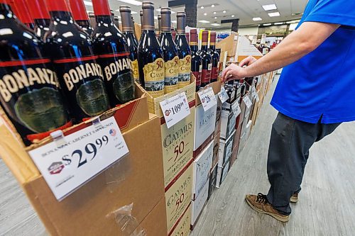 MIKE DEAL / FREE PRESS
Liquor store employees put the final touches on the display of American liqour that will be going on sale at the Crestview MLCC Wednesday morning.
Reporter: Scott Billeck
251210 - Wednesday, December 10, 2025.